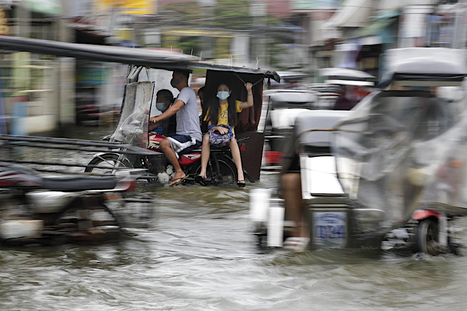 Eine überflutete Straße in der Provinz Pampanga im Norden der Philippinen.