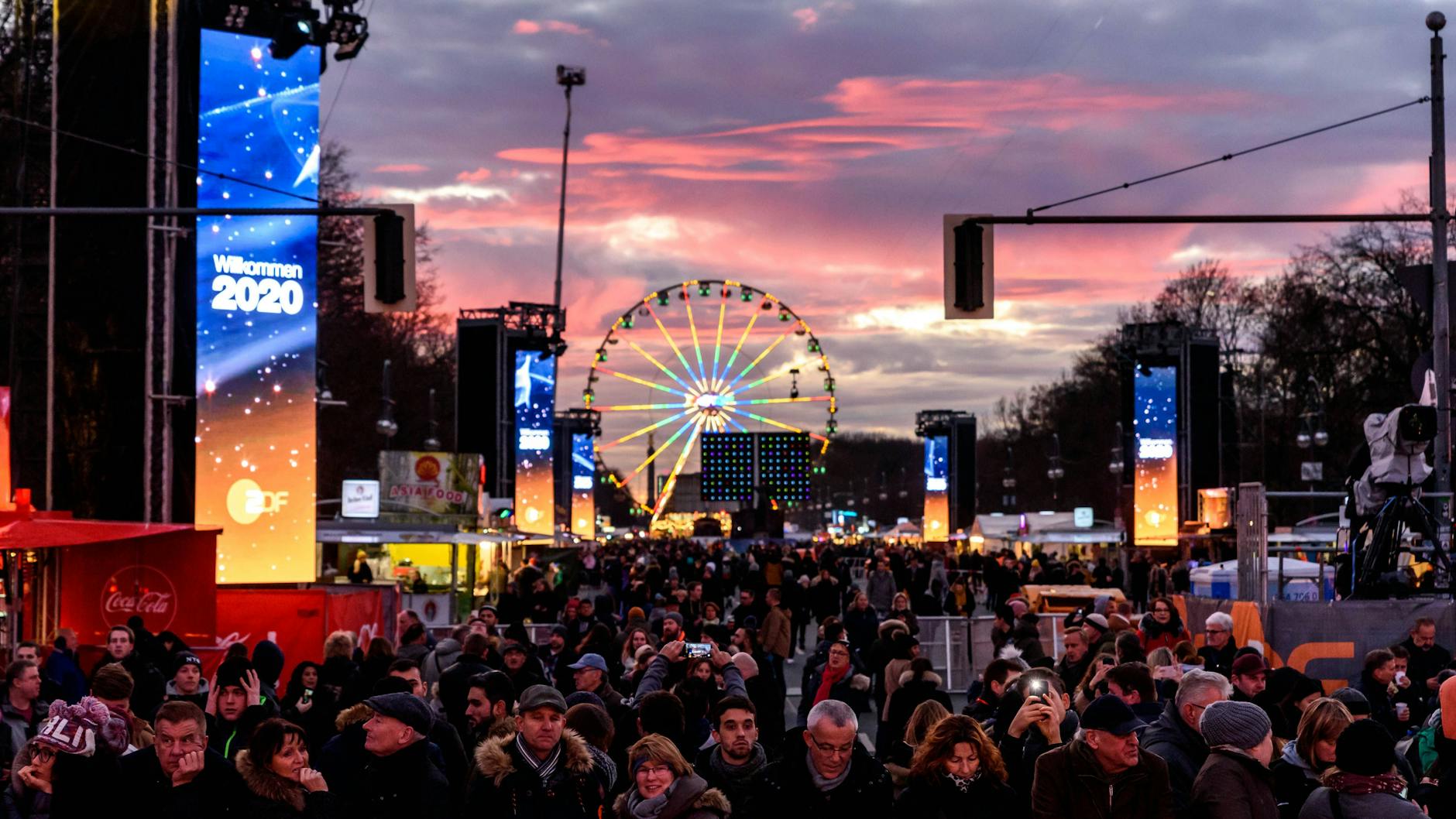 The calm before the storm: Berliners gather on Straße des 17. Juni for last year's New Year's Eve party welcoming 2020 at the Brandenburg Gate.