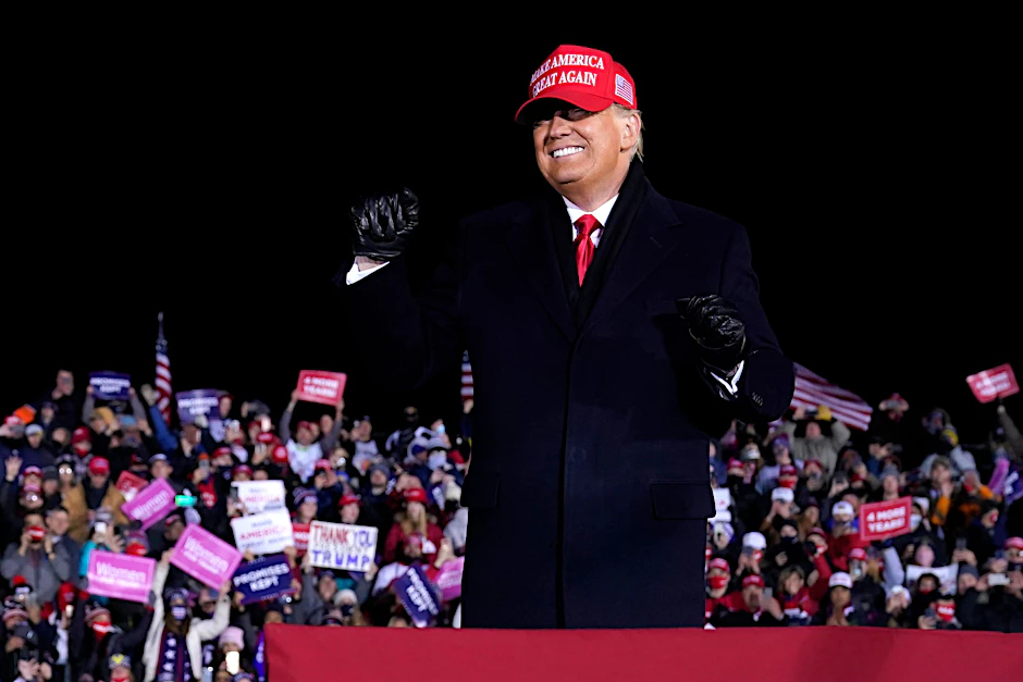 President Donald Trump dances after a campaign rally at Gerald R. Ford International Airport, early Tuesday, Nov. 3, 2020, in Grand Rapids, Mich. (AP Photo/Evan Vucci)