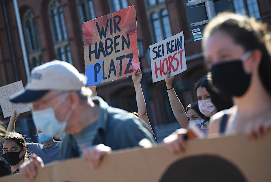 The signs say Germany has plenty of room and that you shouldn