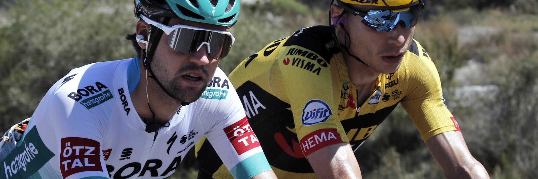 Maximilian Schachmann (l.), hier neben Landsmann Tony Martin, beißt sich trotz Verletzung durch diese Tour.