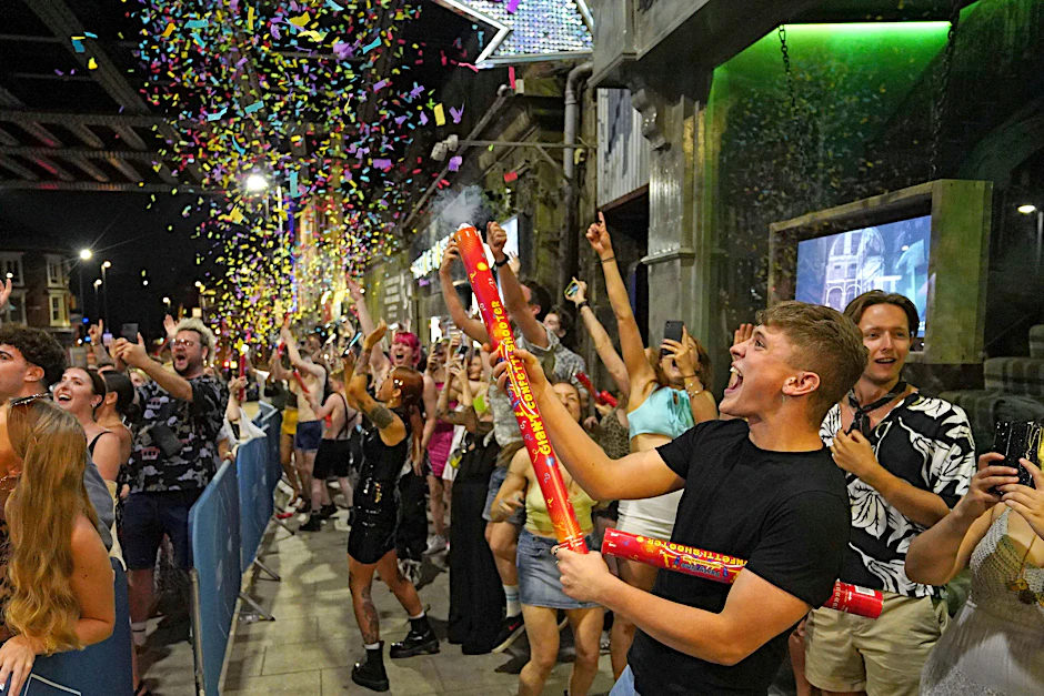 Revellers celebrate the start of "Freedom Day" at midnight on 19 July in Leeds, England.