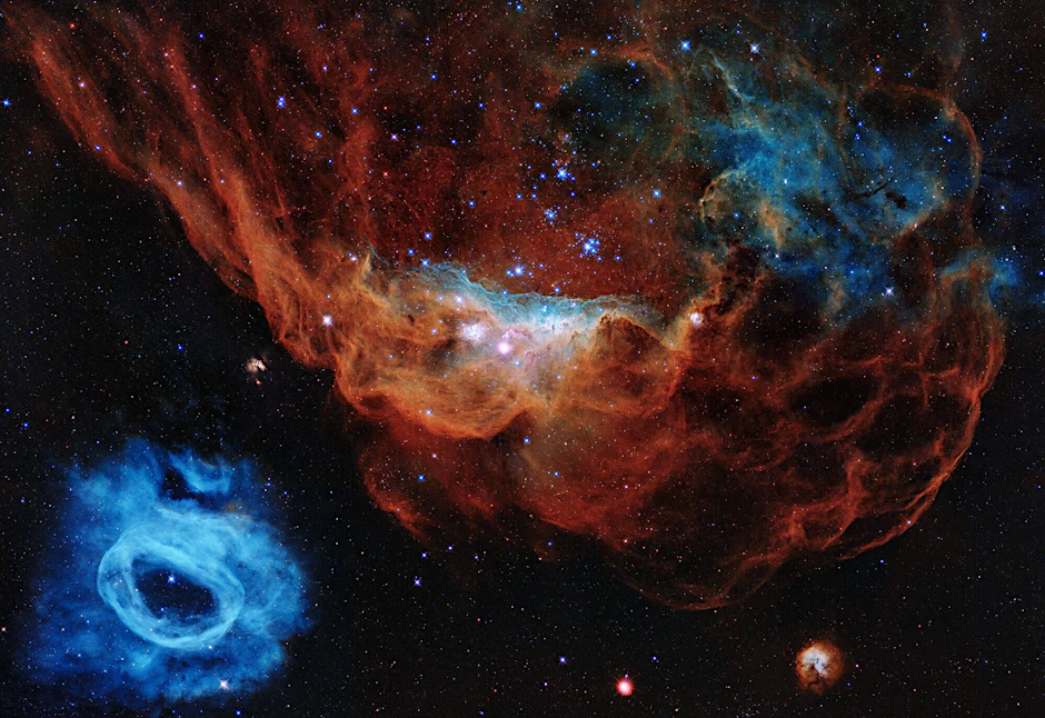 Wie will man solche Bilder noch toppen? Dieses Hubble-Foto zeigt zwei interstellare Wolken, in denen Sterne entstehen. Sie befinden sich in der Großen Magellanschen Wolke, etwa 163.000 Lichtjahre von der Erde entfernt.