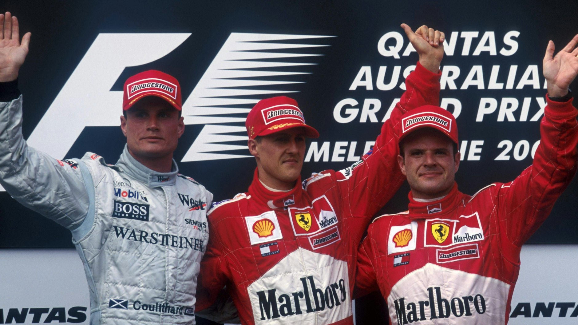 Hatte sich eine ganze Weile wenig zu sagen: Die Ferrari-Piloten Michael Schumacher und Rubens Barrichello und Mercedes-Fahrer David Coulthard (l.)