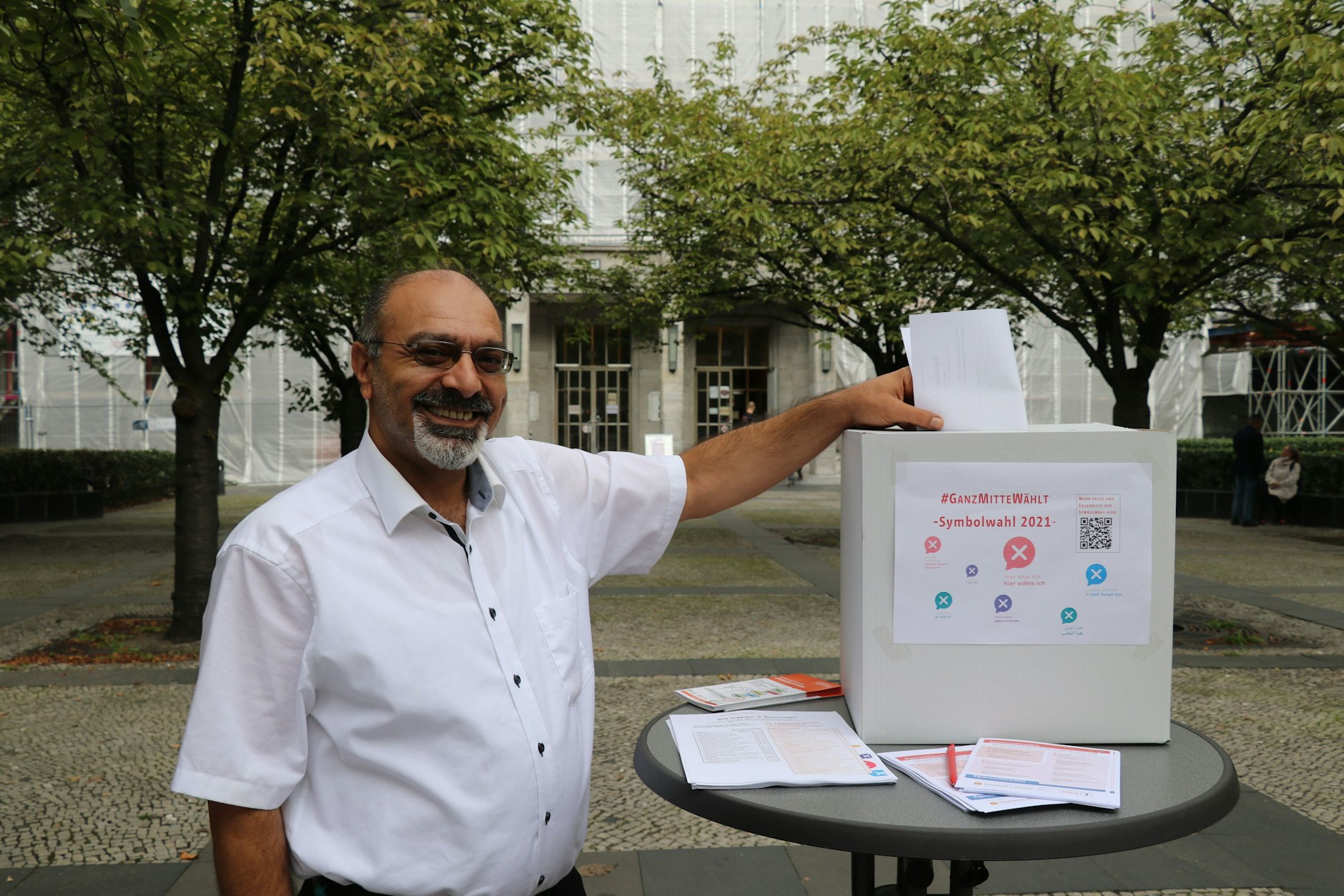 Herr Cayir, doorman at Rathaus Tiergarten, casts his vote in Mitte's "symbolic election". He has lived in Berlin since 1986, but still has no German passport.