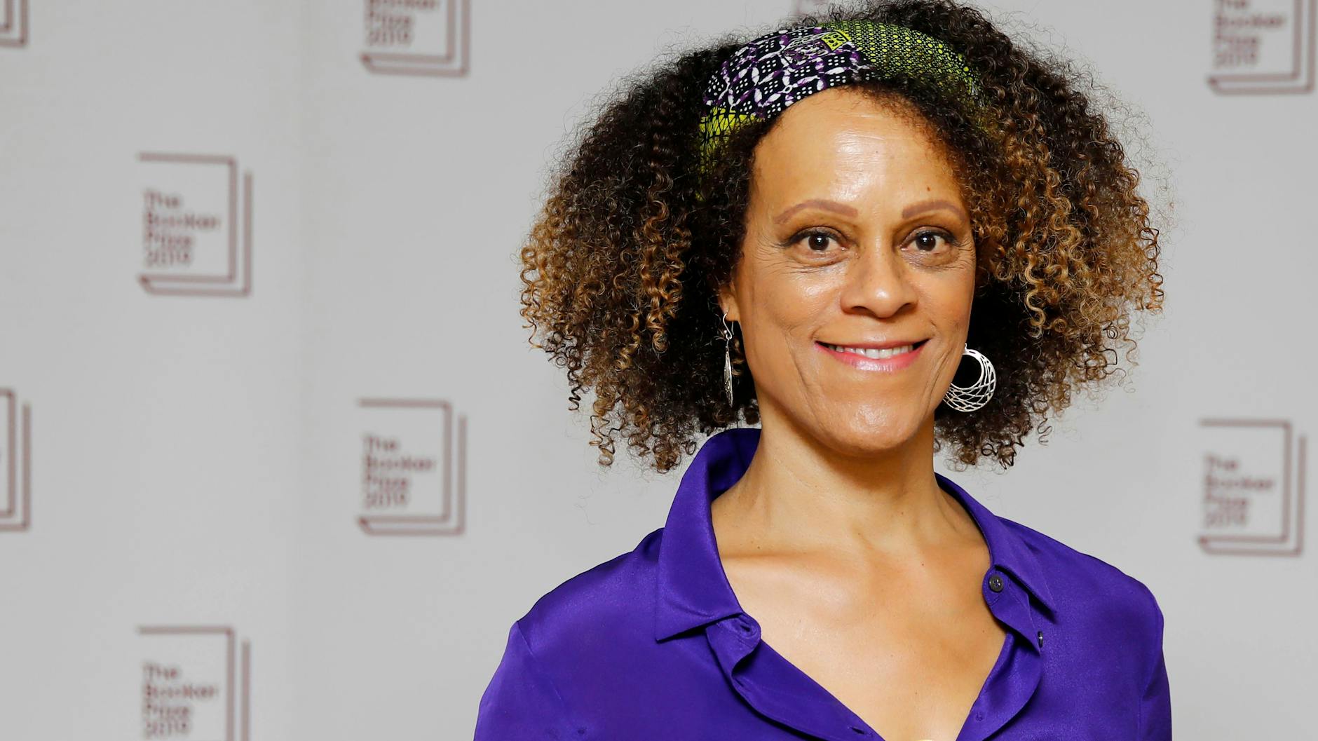 Bernardine Evaristo with her book <em>Girl, Woman, Other</em> at the shortlisting for the Booker Prize 2019.