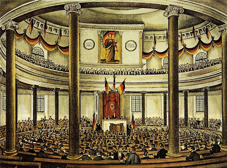 So bürgerlich-maskulin-kirchlich fing es an mit den Linken und den Rechten: die Nationalversammlung in der Frankfurter Paulskirche 1848, illustriert von Ludwig von Elliot. Einzige Frau war die „Germania“, hinter der sich die Orgel verbarg.
