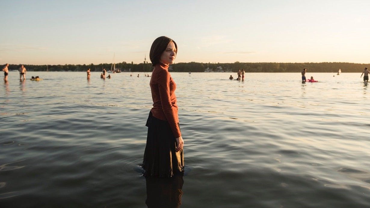 Esty (Shira Haas) in the lake at Wannsee in a scene from Unorthodox.