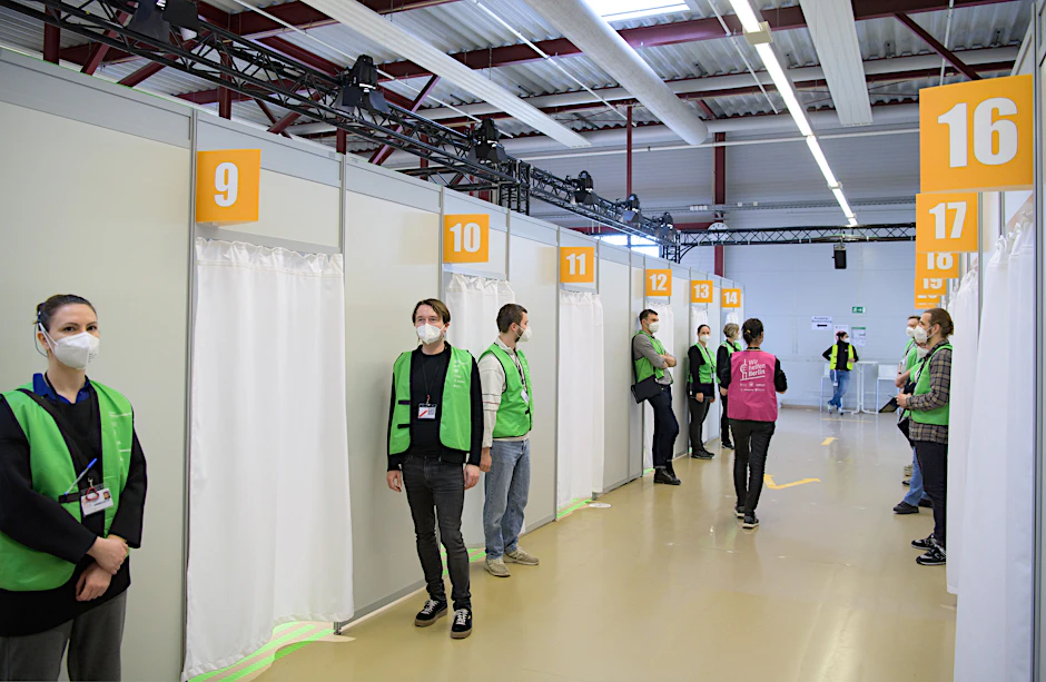 Your turn, Group 3. Vaccination personnel at the former Tegel airport.