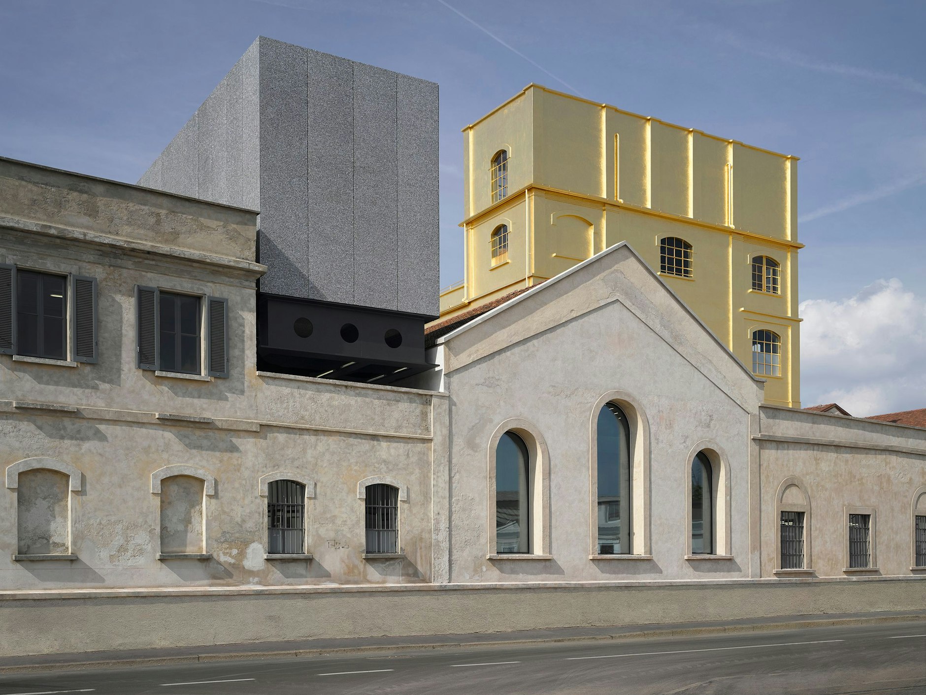 Architect Rem Koolhaas covered the so-called Haunted House at Milan's Fondazione Prada in real gold leaf, transforming it into a gleaming landmark of a previously precarious neighbourhood.