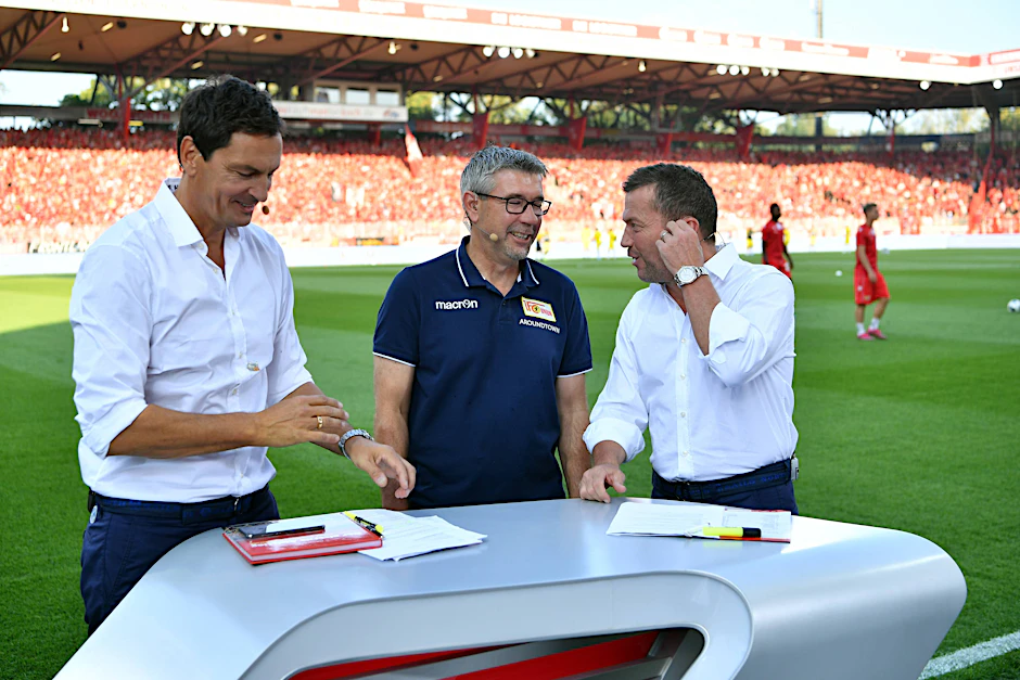 Wenn selbst Chef-Experte Lothar Matthäus (r.) sprachlos ist, weiß man, dass der 1. FC Union und Trainer Urs Fischer (M.) mal wieder Außergewöhnliches geleistet hat.