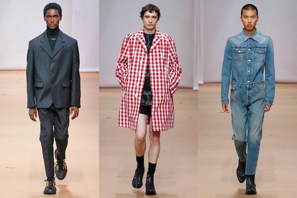 Anzug, Karo-Mantel und Jeans-Look: Miuccia Prada und Raf Simons haben am Sonntag eine schmal geschnittene Menswear-Kollektion gezeigt, die den Mann mit dynamischer Eleganz und Raffinesse schmückt. Bitte, deutsche Männer, schaut euch das an.