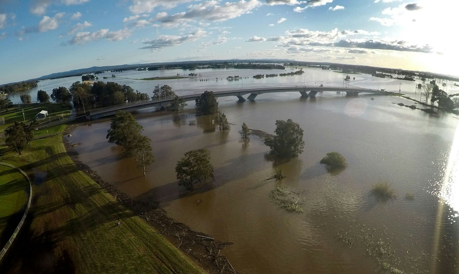 Floodwaters sound the Fitzgerald bridge in Raymond Terrace cutting Raymond Terrace road to Maitland, Saturday, July 9, 2022. Clean-up work has begun in many soaked NSW regions, but 40,000 people remain under evacuation orders amid the danger of still-rising waters. (AAP Image/Darren Pateman) NO ARCHIVING