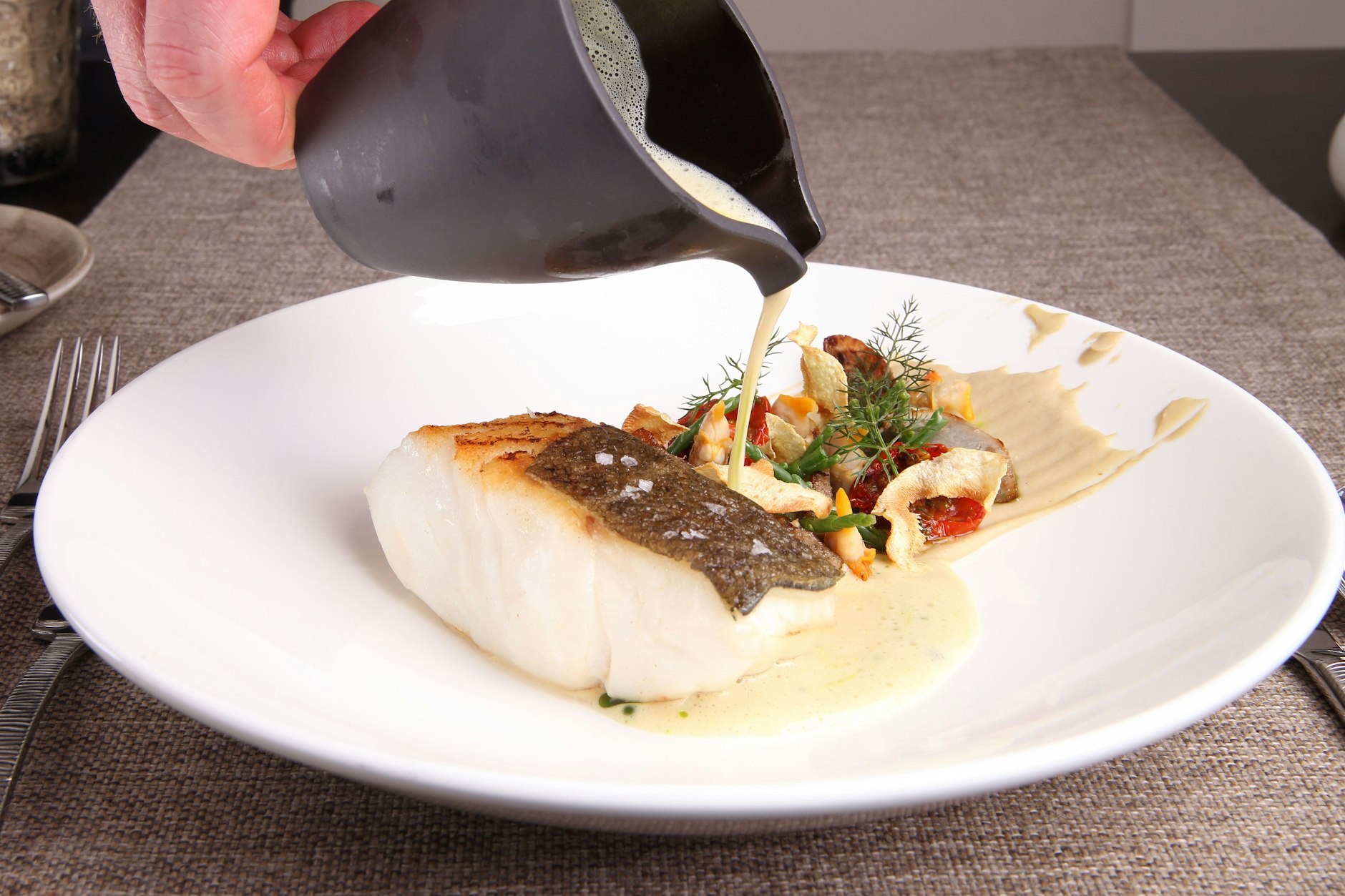 Dieses Gericht hat die Testerin leider nicht gegessen: Kabeljau mit Herzmuscheln, Safran und Artischocken.