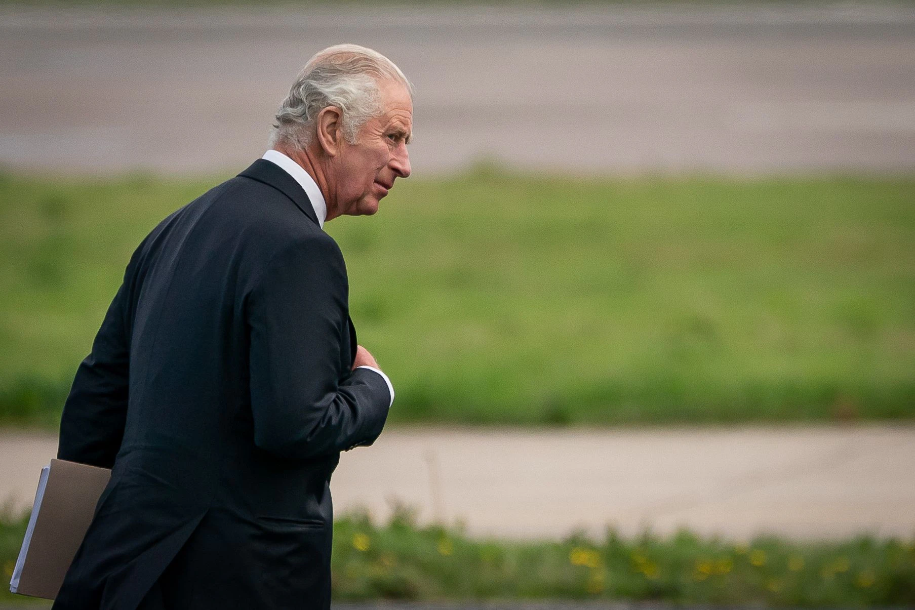 Britain's King Charles III walks to his plane at Aberdeen Airport to travel to London on September 9, 2022, following the death of his mother, Britain's Queen Elizabeth II the previous day. - Queen Elizabeth II, the longest-serving monarch in British history and an icon instantly recognisable to billions of people around the world, died at her Scottish Highland retreat on September 8. (Photo by Aaron Chown / POOL / AFP)