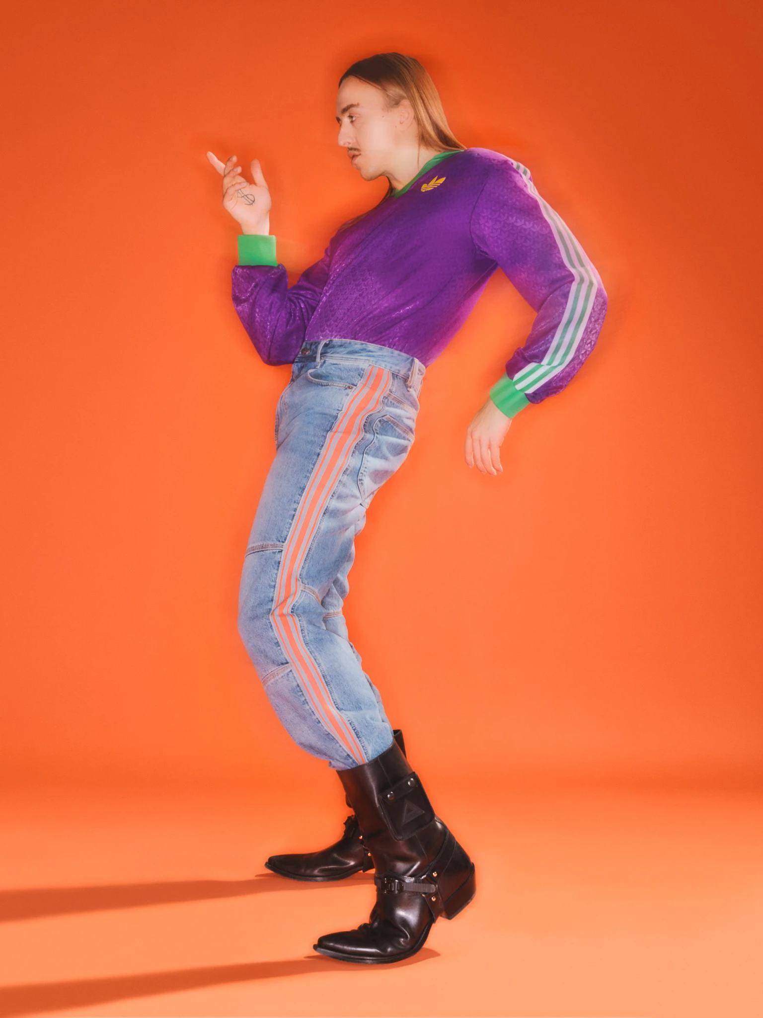 Long sleeve by Adidas, jeans by Diesel and cowboy boots by Iceberg.