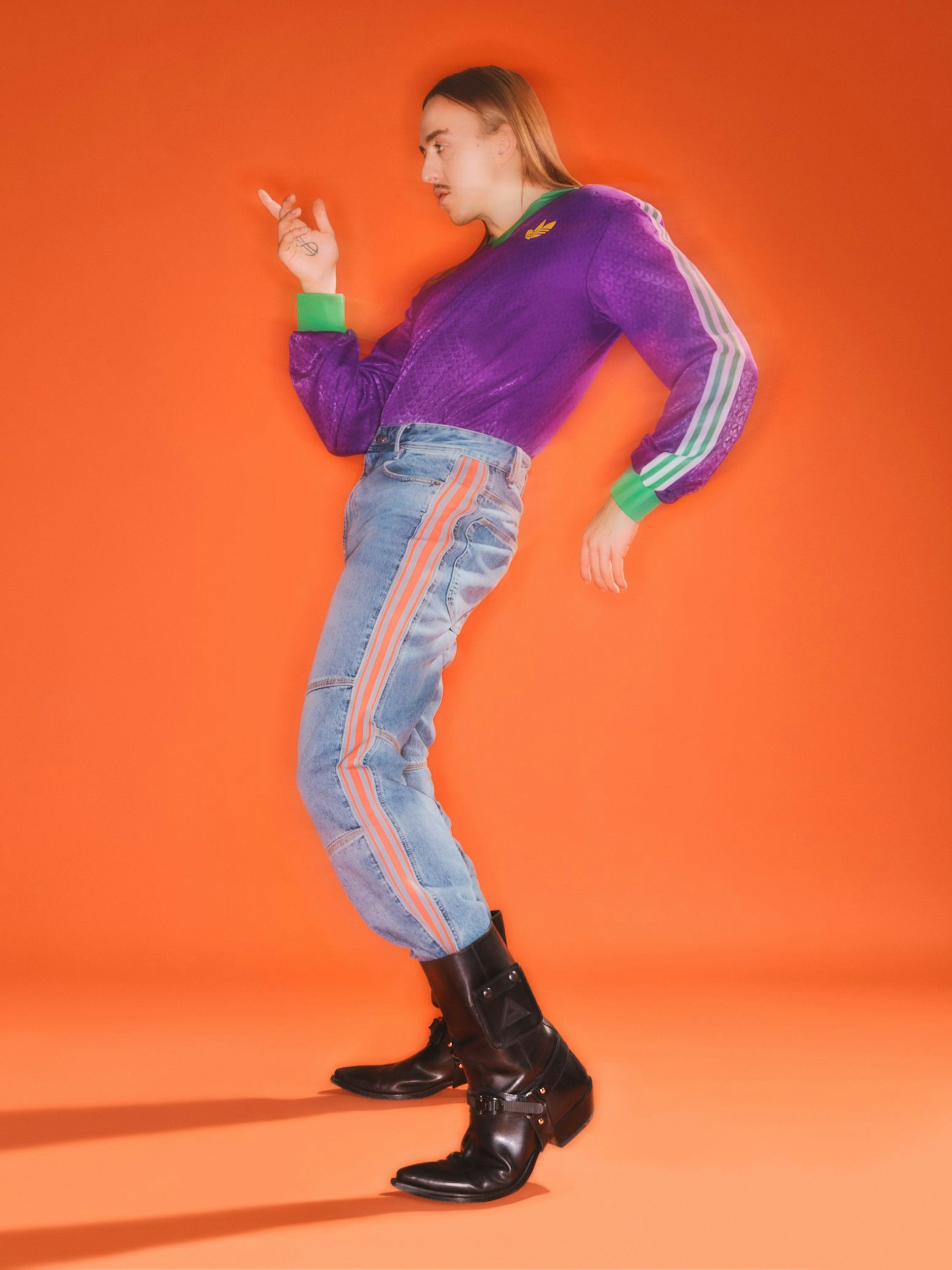 Long sleeve by Adidas, jeans by Diesel and cowboy boots by Iceberg.