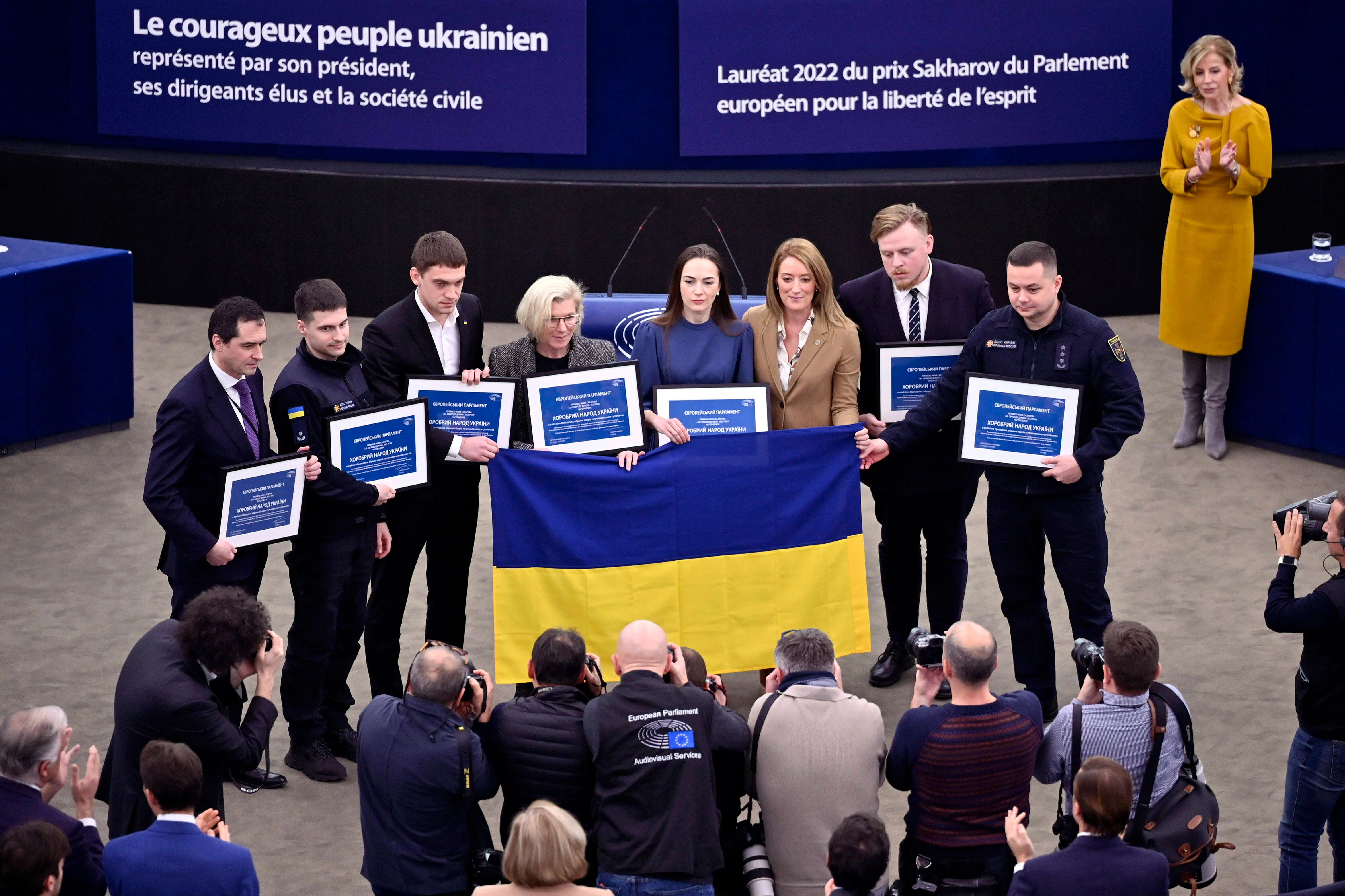 Oleksandra Matviichuk (centre, in blue) with other members of the delegation that accepted the EU Parliament