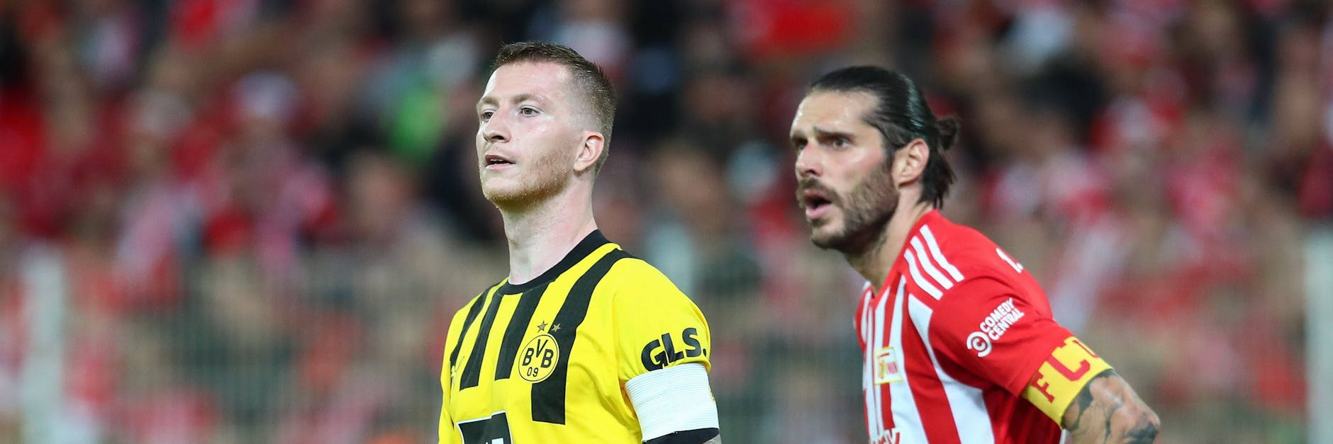 Dortmunds Startruppe um Marco Reus hat den 1. FC Union – hier Christopher Trimmel – sprichwörtlich im Nacken.