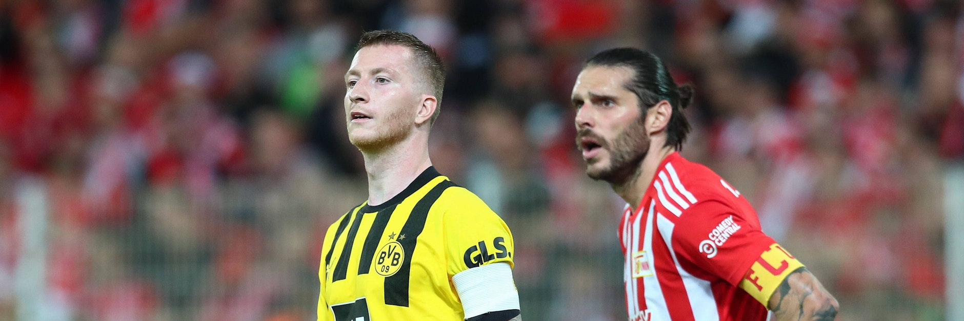 Dortmunds Startruppe um Marco Reus hat den 1. FC Union – hier Christopher Trimmel – sprichwörtlich im Nacken.