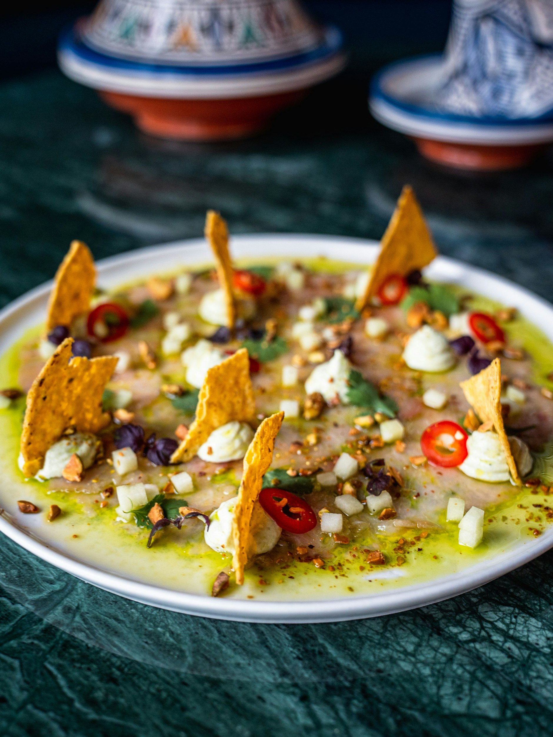 Tacos mit Sashimi in Koriander-Öl.