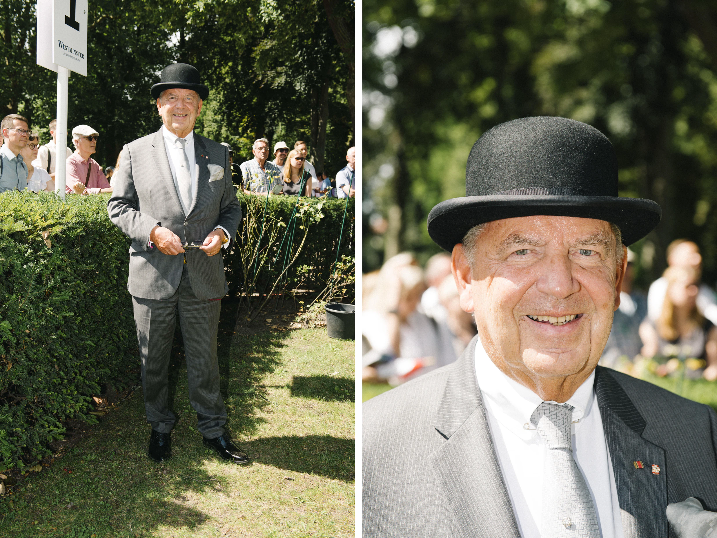 Ohne Schirm, aber mit Charme und Melone ist <strong>Jörg Woltmann</strong>, der Bankier und Inhaber der Königlichen Porzellan-Manufaktur Berlin (KPM), in Hoppegarten unterwegs. Das ikonische Hutmodell hat er sich 1979 selbst geschenkt, zur Eröffnung seiner ersten Bank; der perfekt geschnittene Anzug mit feinen Nadelstreifen kommt „von irgendwo“. Und der blattgolden dekorierte To-go-Becher aus Porzellan, mit dem er später am Tag gesichtet wurde? „Nicht ohne mein KPM!“, ruft Woltmann über die Schulter.