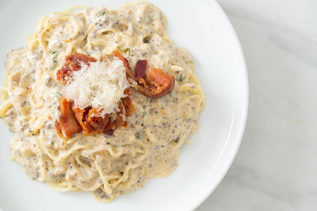 Aromatisch und cremig: Rezept für Spaghetti mit Champignons in Sahnesauce