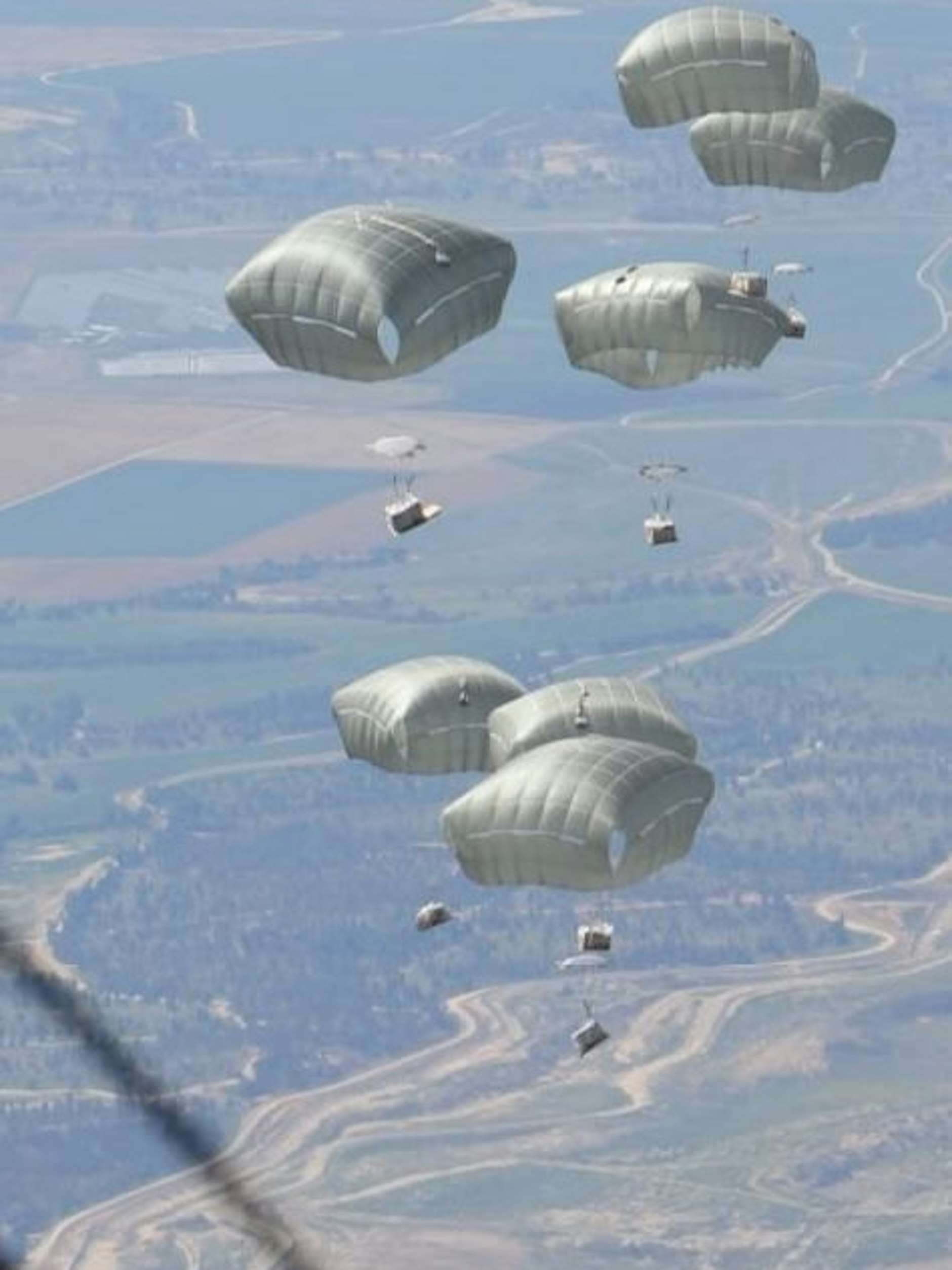 Tonnenschwere Hilfspakete an Fallschirmen werden von Flugzeugen über Gaza abgeworfen.