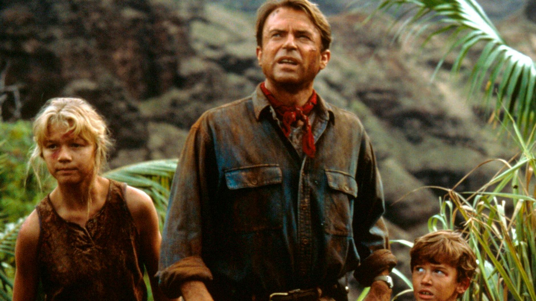 Die Darsteller Ariana Richards, Sam Neill und Joseph Mazzello in einer Szene des Films „Jurassic Park“.