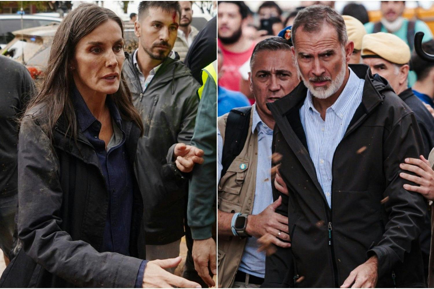 Königin Letizia mit Schlamm in Gesicht und auf der Kleidung, König Felipe kann nicht vor den Schlamm-Attacken geschützt werden.