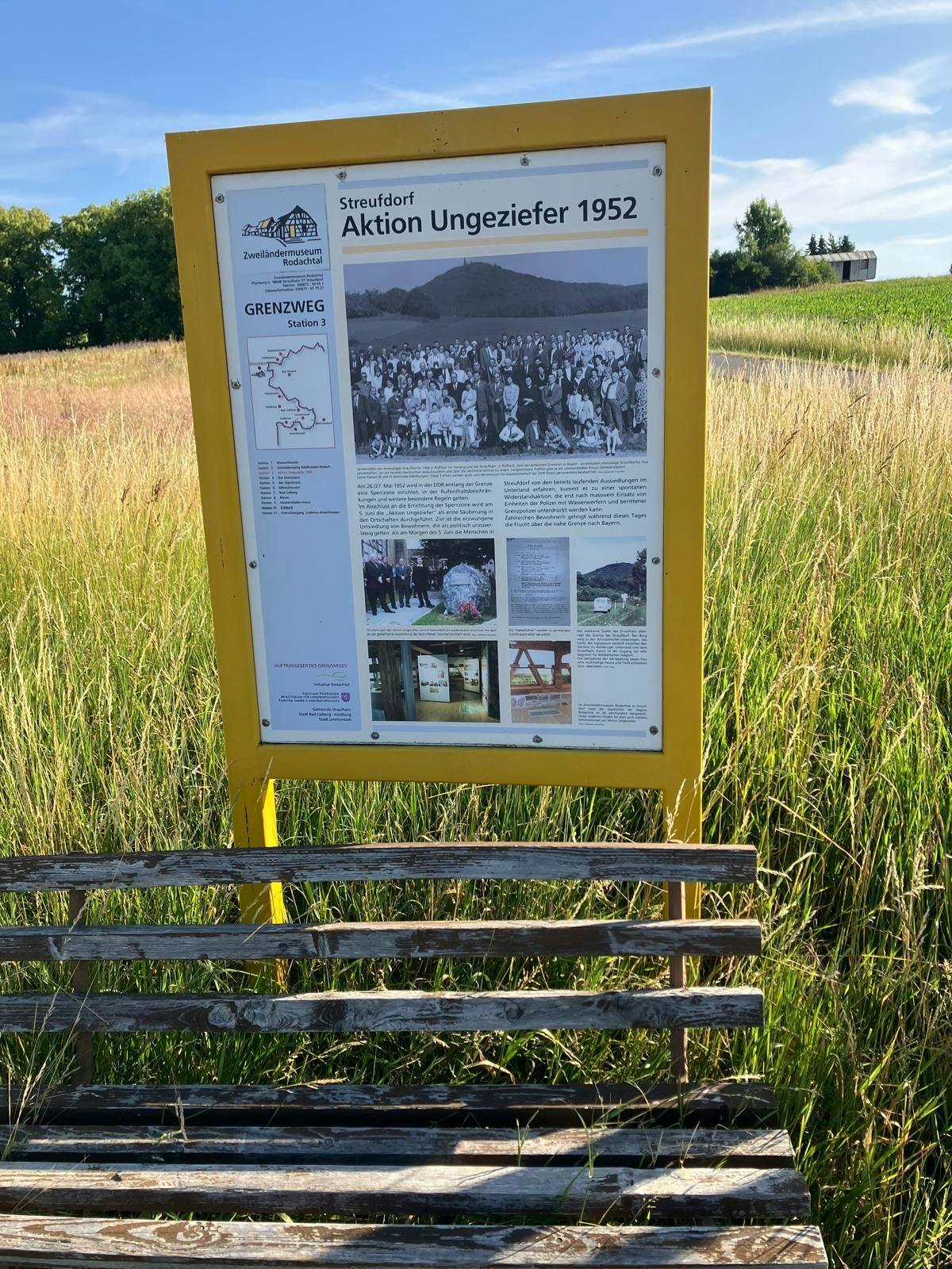 A sign on the roadside near Streufdorf commemorates the forced relocation of residents from border villages. The state called it